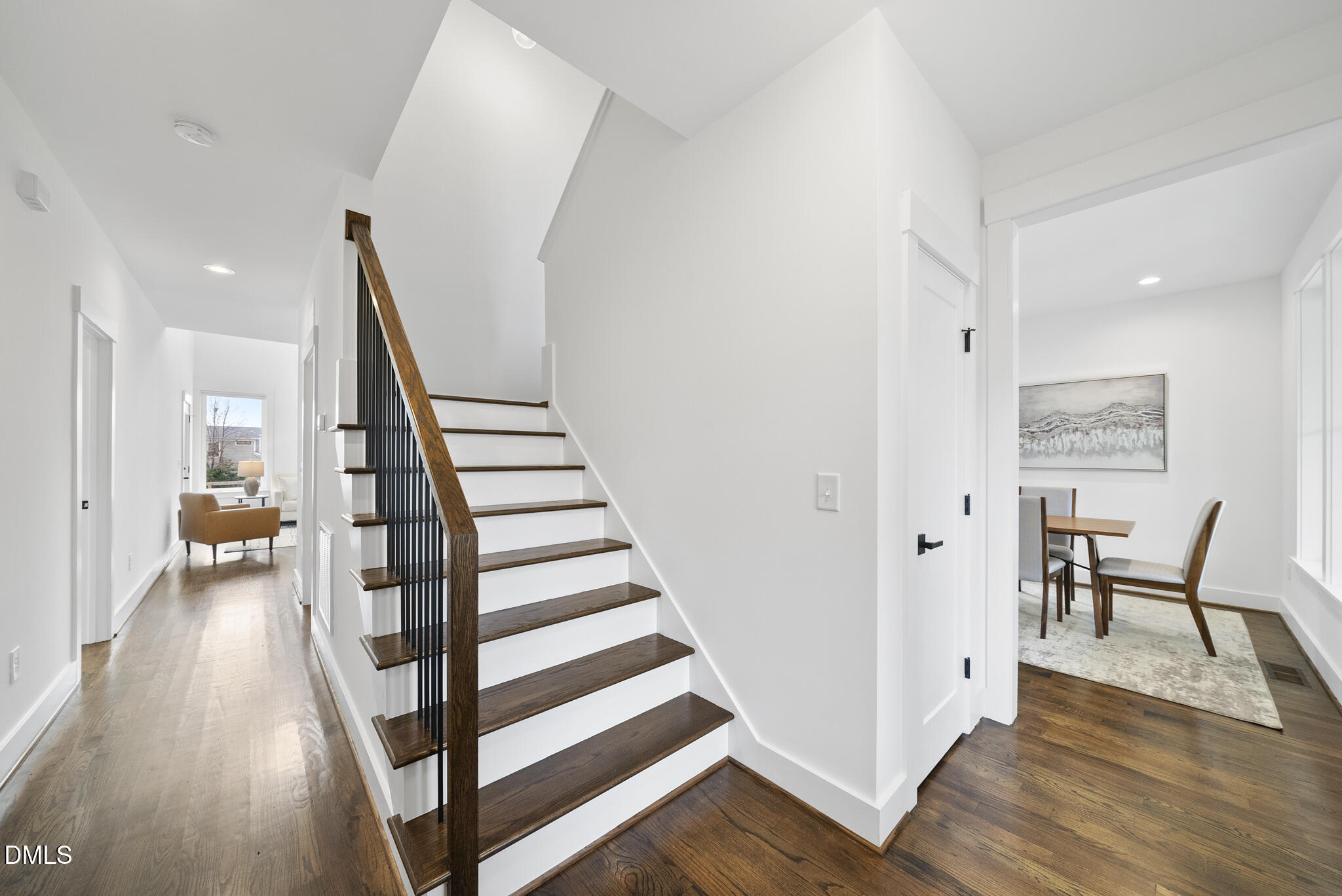 200 Bledsoe Avenue Raleigh, NC 27601 - Photo 3 of 42 a view of a hallway with furniture and wooden floor