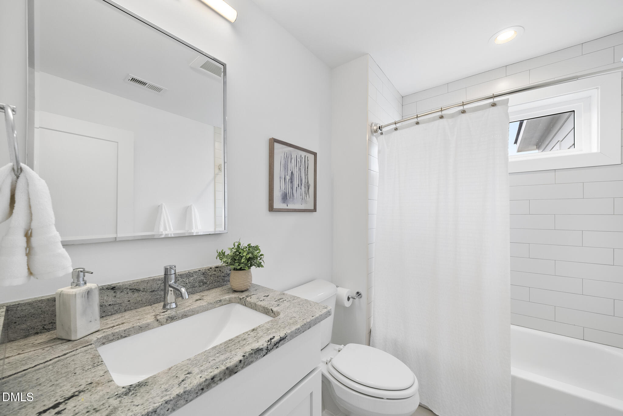 200 Bledsoe Avenue Raleigh, NC 27601 - Photo 31 of 42 a bathroom with a granite countertop sink mirror vanity and toilet