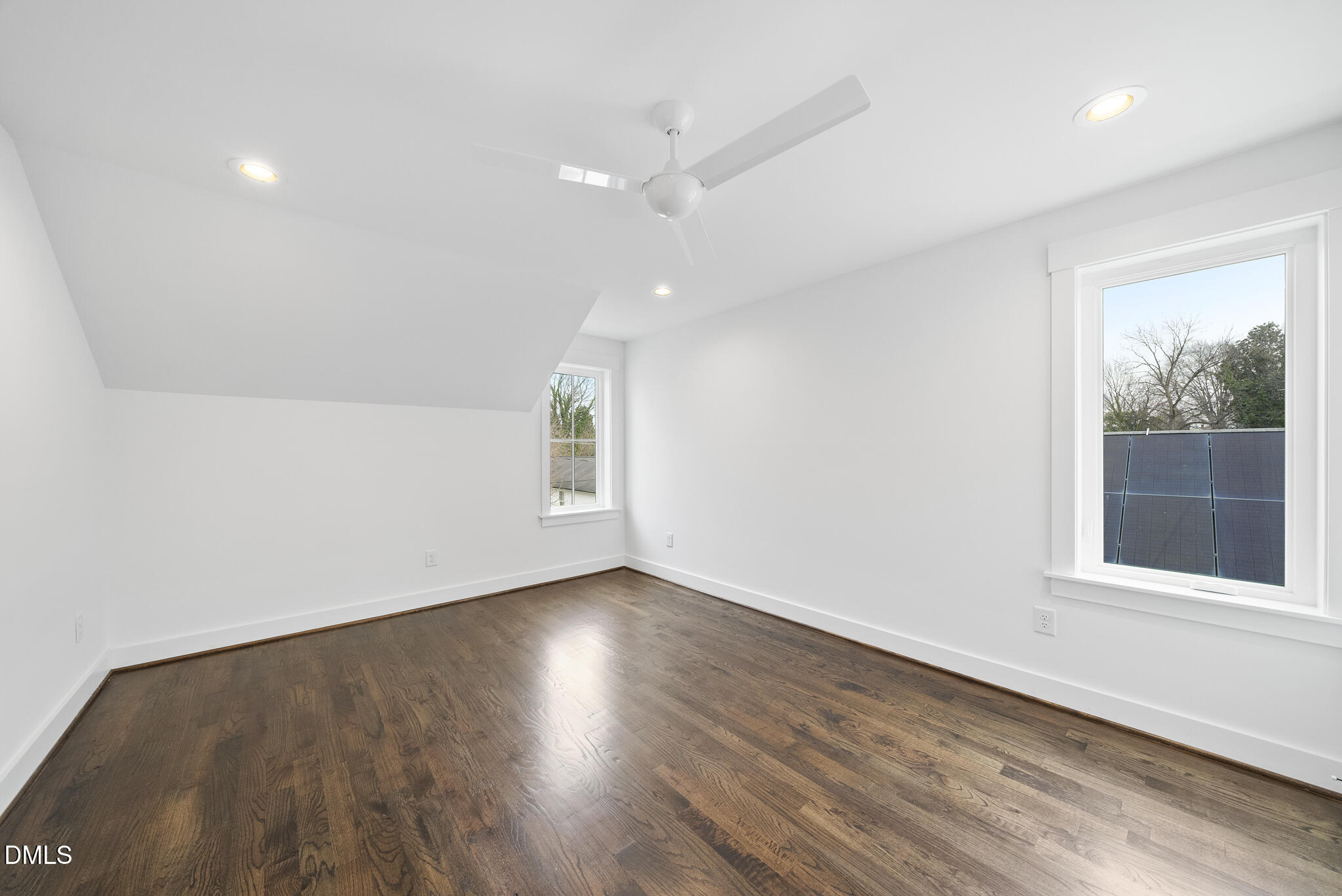 200 Bledsoe Avenue Raleigh, NC 27601 - Photo 32 of 42 an empty room with wooden floor and windows