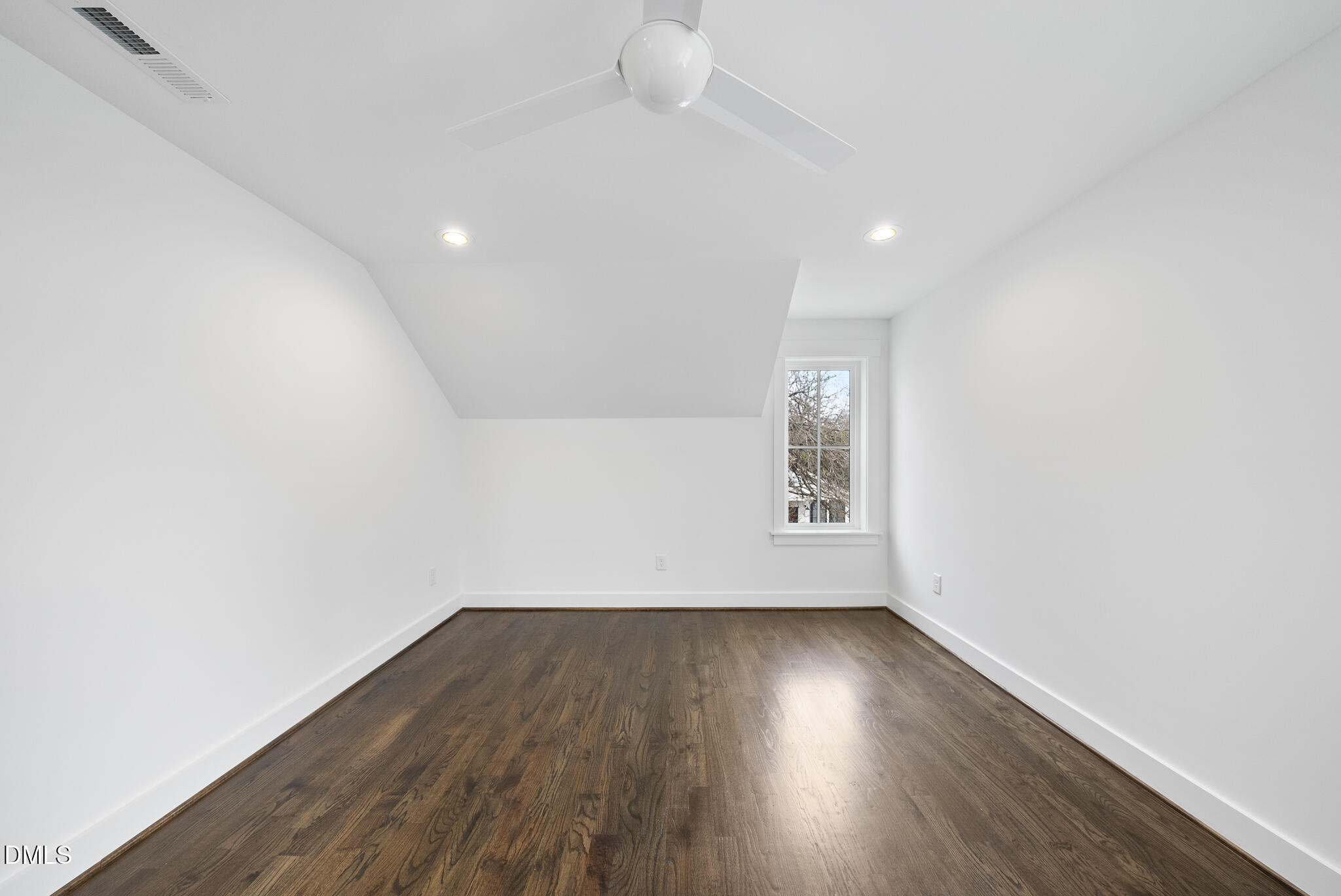200 Bledsoe Avenue Raleigh, NC 27601 - Photo 33 of 42 an empty room with wooden floor and windows