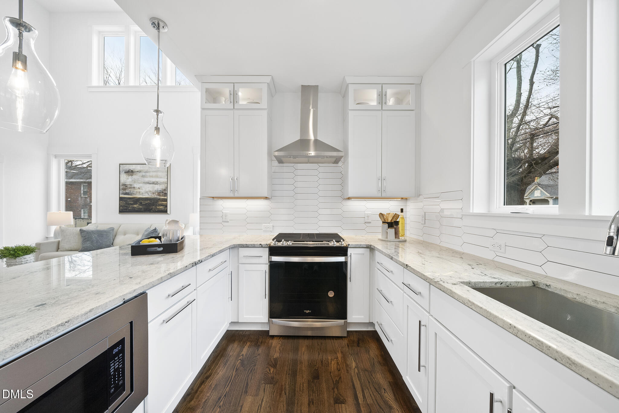 200 Bledsoe Avenue Raleigh, NC 27601 - Photo 9 of 42 a kitchen with stainless steel appliances granite countertop a stove and a sink