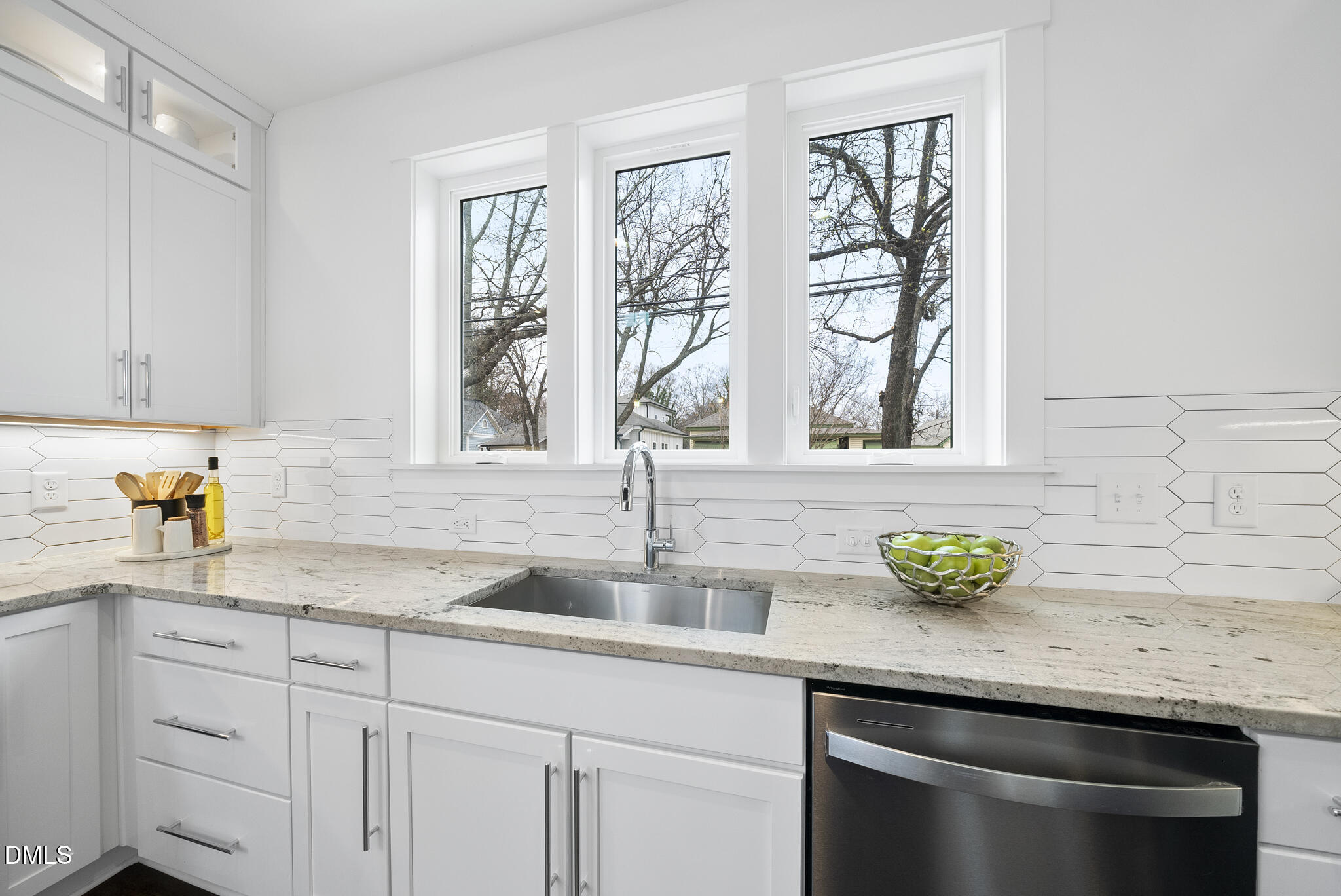 200 Bledsoe Avenue Raleigh, NC 27601 - Photo 10 of 42 a kitchen with granite countertop stainless steel appliances a sink and cabinets