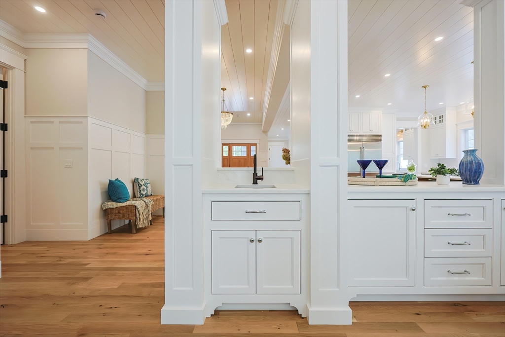 28 Quaker Run Road Mashpee, MA 02649 - Photo 11 of 42 a bathroom with a double vanity sink and a mirror