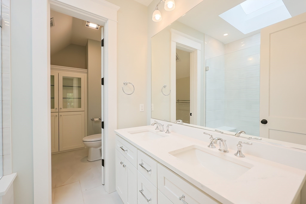 28 Quaker Run Road Mashpee, MA 02649 - Photo 20 of 42 a bathroom with a sink a toilet and shower