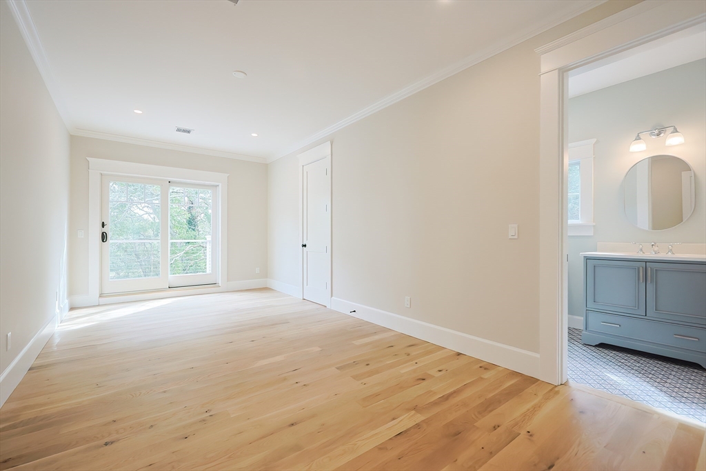 28 Quaker Run Road Mashpee, MA 02649 - Photo 26 of 42 a view of an empty room with wooden floor and a window