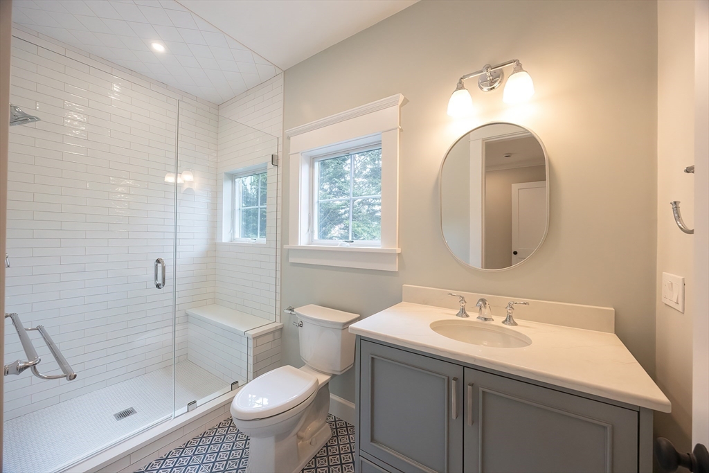 28 Quaker Run Road Mashpee, MA 02649 - Photo 27 of 42 a bathroom with a toilet sink and shower