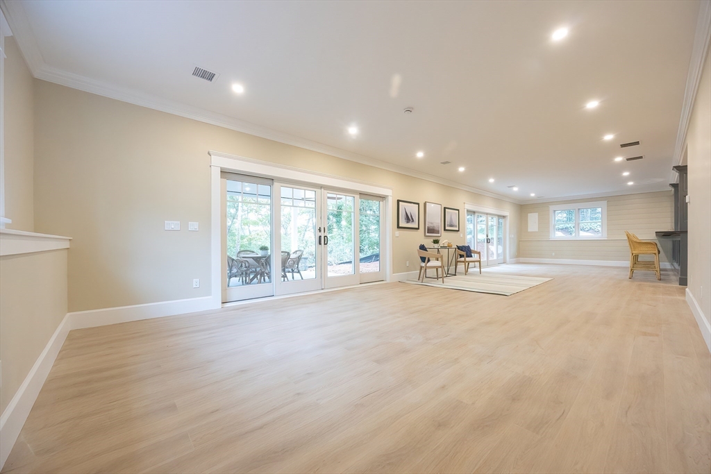 28 Quaker Run Road Mashpee, MA 02649 - Photo 33 of 42 a view of a big room with wooden floor and windows
