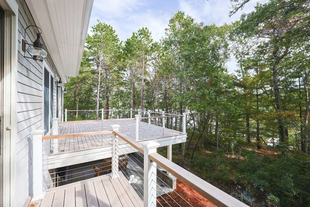 28 Quaker Run Road Mashpee, MA 02649 - Photo 35 of 42 a view of a balcony with chairs