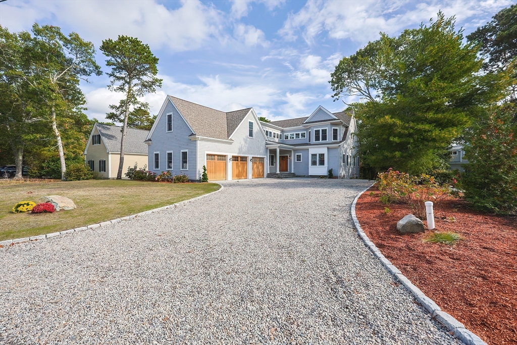 28 Quaker Run Road Mashpee, MA 02649 - Photo 38 of 42 a view of a house with a yard