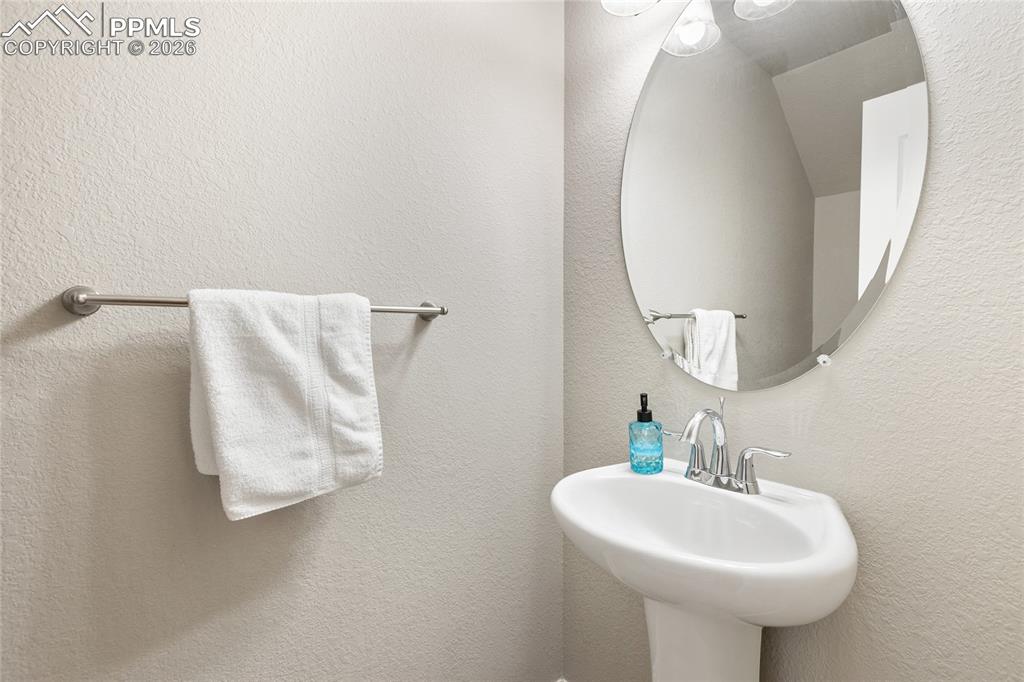 1820 Lower Gold Camp Road Colorado Springs, CO 80905 - Photo 17 of 27 a bathroom with a sink a mirror and bathtub