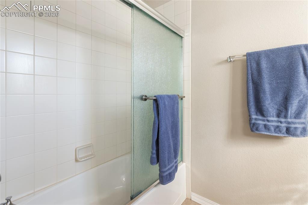 1820 Lower Gold Camp Road Colorado Springs, CO 80905 - Photo 21 of 27 a bathroom with a shower and a toilet