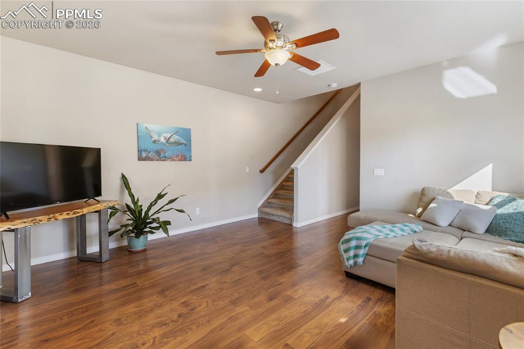 1820 Lower Gold Camp Road Colorado Springs, CO 80905 - Photo 5 of 27 a living room with furniture and a flat screen tv