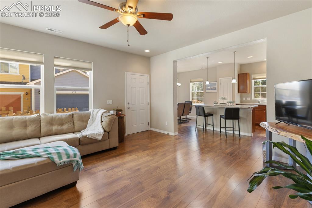 1820 Lower Gold Camp Road Colorado Springs, CO 80905 - Photo 6 of 27 a living room with furniture and a flat screen tv