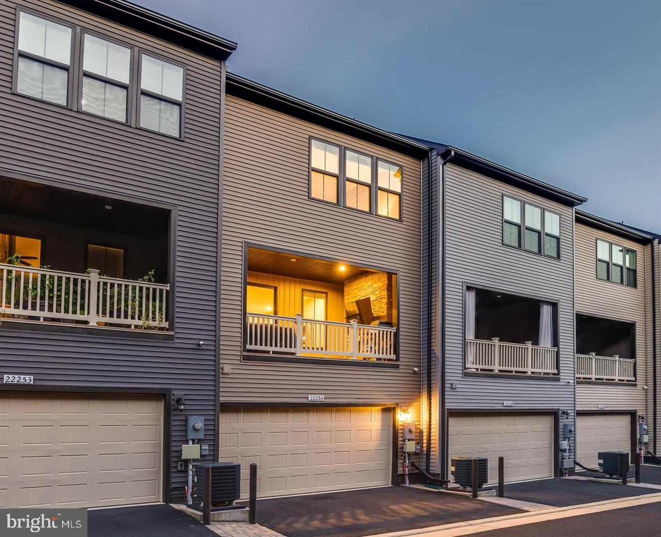 22255 Sims Terrace Ashburn, VA 20148 - Photo 1 of 27 a front view of a building with a street