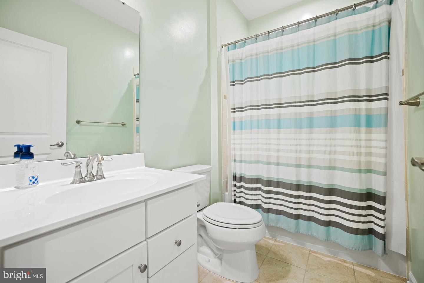 22255 Sims Terrace Ashburn, VA 20148 - Photo 14 of 27 a bathroom with a sink a toilet and shower