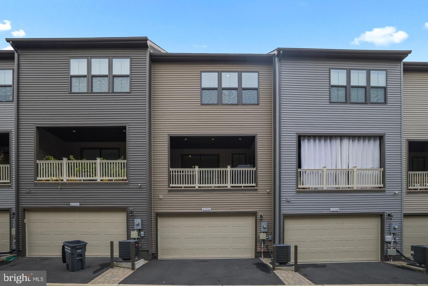 22255 Sims Terrace Ashburn, VA 20148 - Photo 26 of 27 a front view of a house with large windows