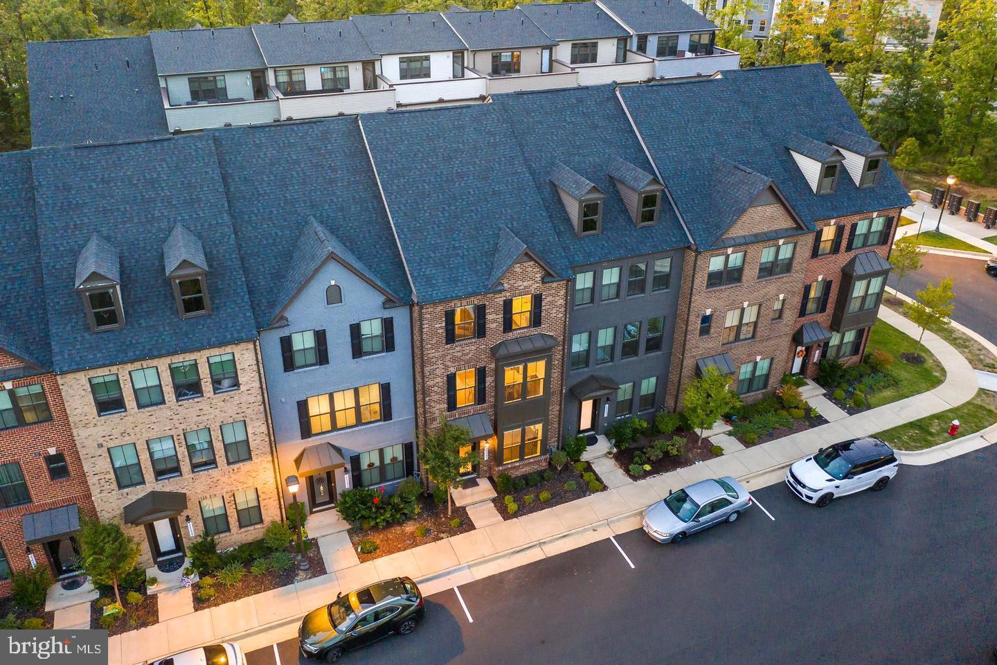 22255 Sims Terrace Ashburn, VA 20148 - Photo 4 of 27 an aerial view of multiple houses with a street