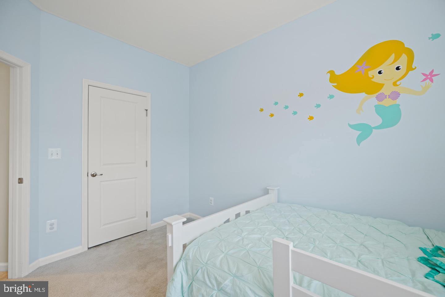 22255 Sims Terrace Ashburn, VA 20148 - Photo 7 of 27 a bedroom with a bed and painting on the wall
