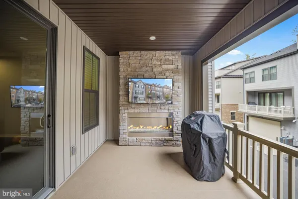 a view of a porch with furniture and front door