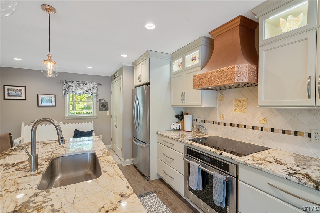 1932 Rittenhouse Square Tully, NY 13159 - Photo 12 of 42 Lighted upper custom kitchen cabinets