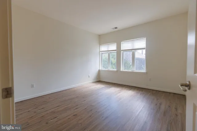 a view of a hallway with washer and dryer