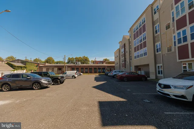 a front view of a building with outdoor space