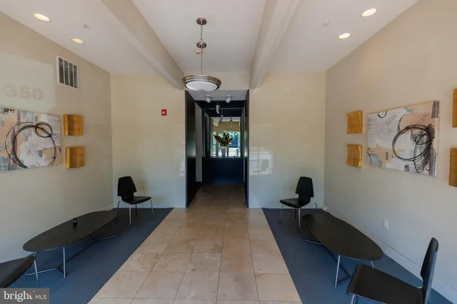a view of a hallway with workspace