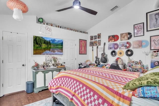 a bedroom with a bed and a window