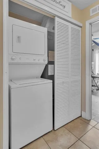 a living room with furniture a dining table and a fireplace