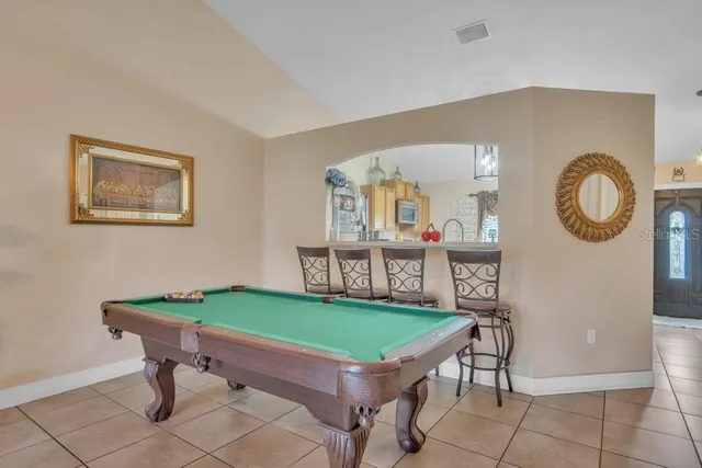 a room with furniture and a clock