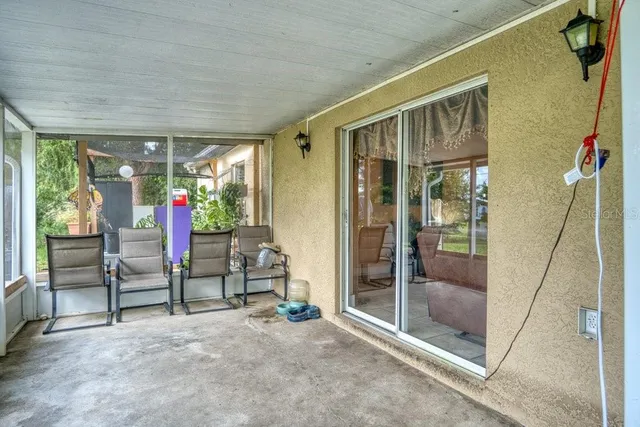 a kitchen with cabinets stainless steel appliances and a window