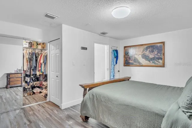 a view of a house with a backyard and sitting area