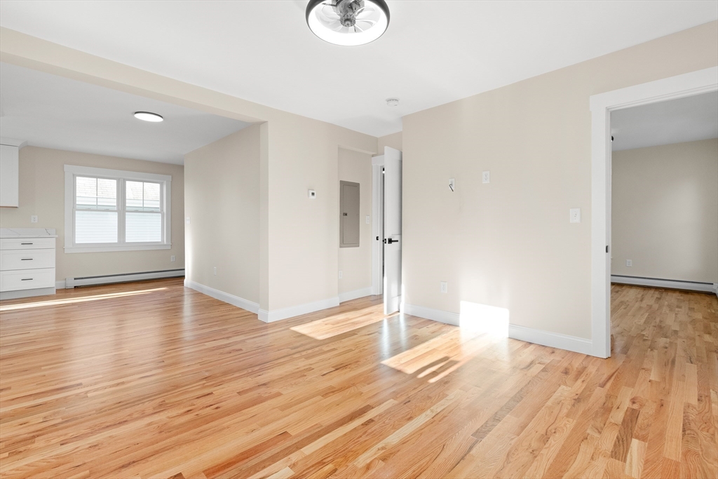 20 Beacon Street Gloucester, MA 01930 - Photo 14 of 35 a view of empty room with wooden floor and window