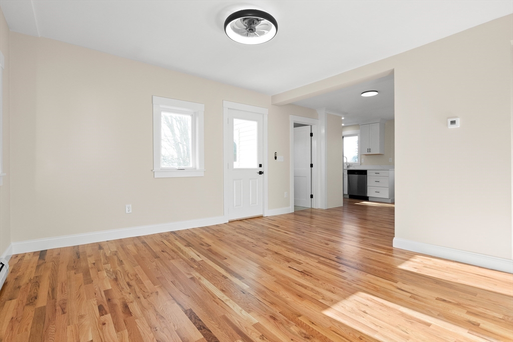 20 Beacon Street Gloucester, MA 01930 - Photo 15 of 35 an empty room with wooden floor and windows