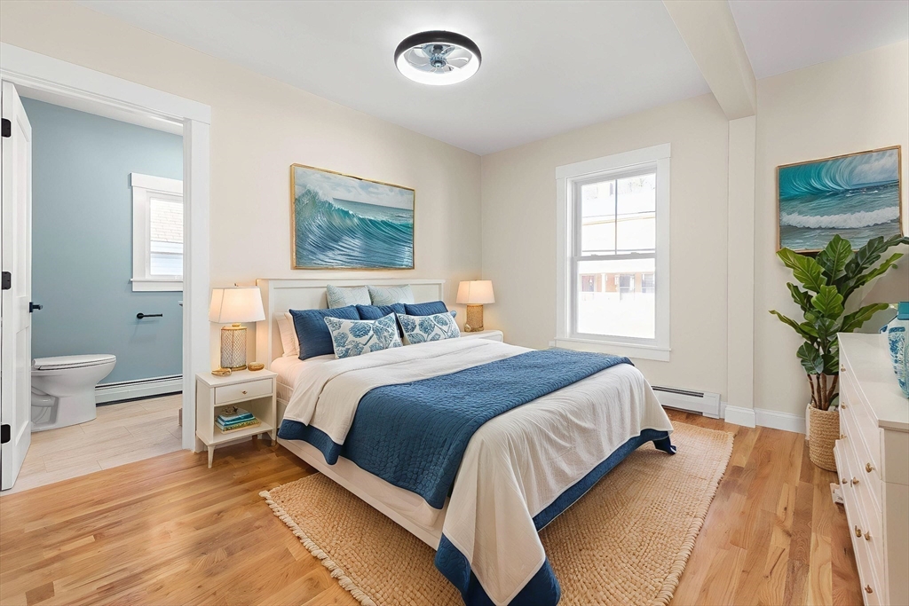 20 Beacon Street Gloucester, MA 01930 - Photo 16 of 35 a bedroom with a large bed and a window