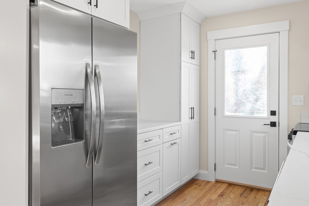 20 Beacon Street Gloucester, MA 01930 - Photo 25 of 35 a kitchen with a refrigerator and a window