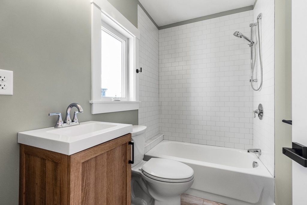 20 Beacon Street Gloucester, MA 01930 - Photo 28 of 35 a bathroom with a sink and a mirror