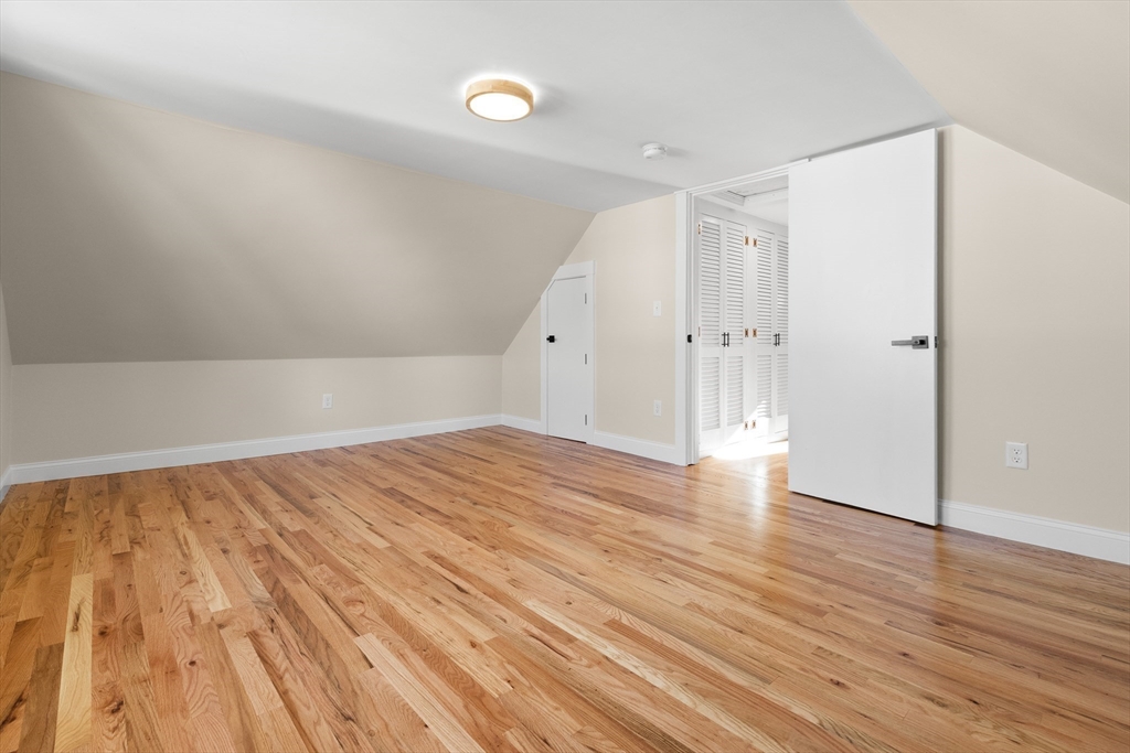 20 Beacon Street Gloucester, MA 01930 - Photo 30 of 35 a view of an empty room and wooden floor