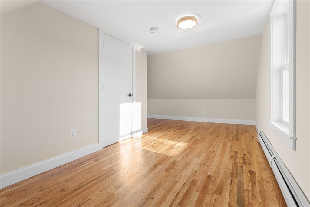 20 Beacon Street Gloucester, MA 01930 - Photo 32 of 35 a view of empty room with wooden floor