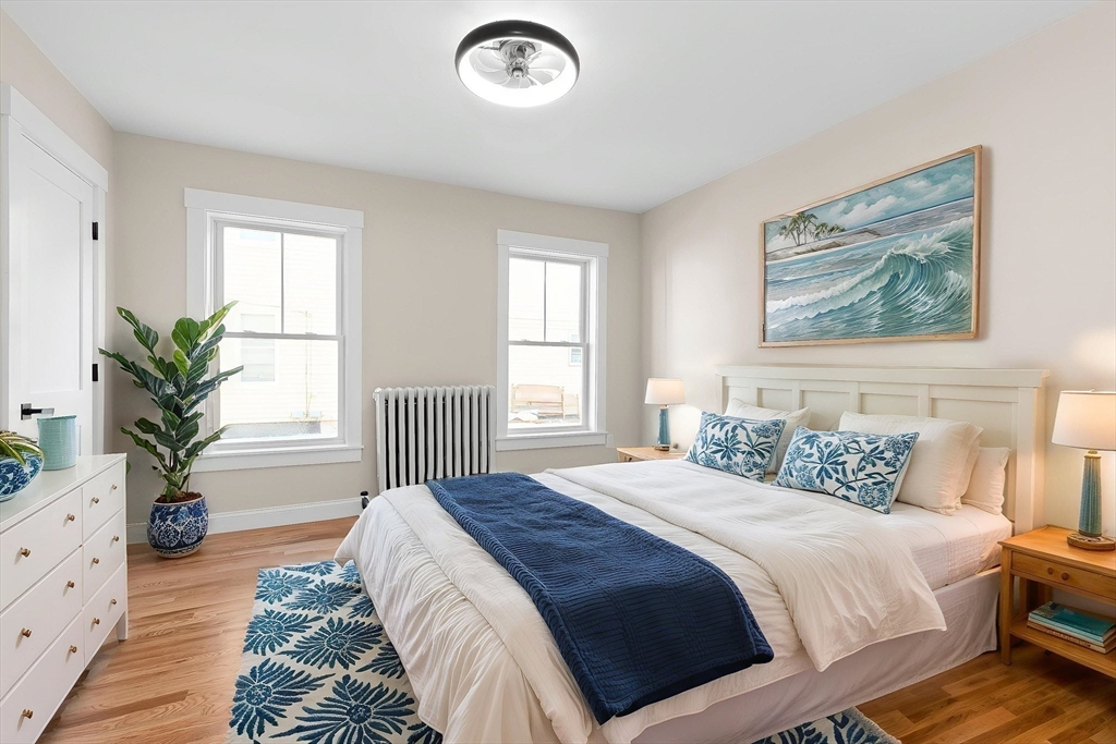 20 Beacon Street Gloucester, MA 01930 - Photo 10 of 35 a bedroom with a large bed and a window