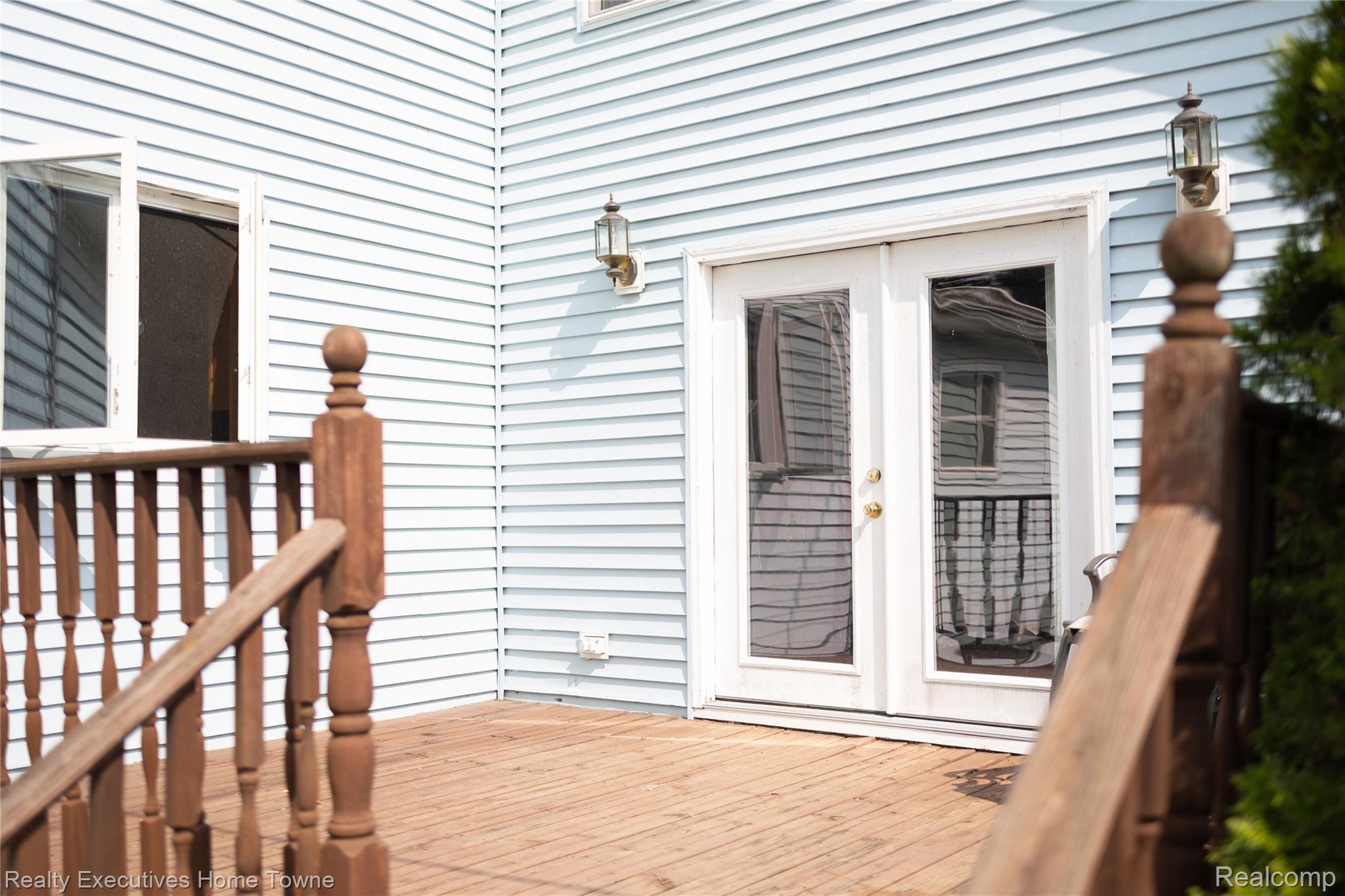 2715 Cash Road Applegate, MI 48401 - Photo 25 of 59 Outdoor deck off lower level BR featuring wood-finish flooring, wood railings, and white siding