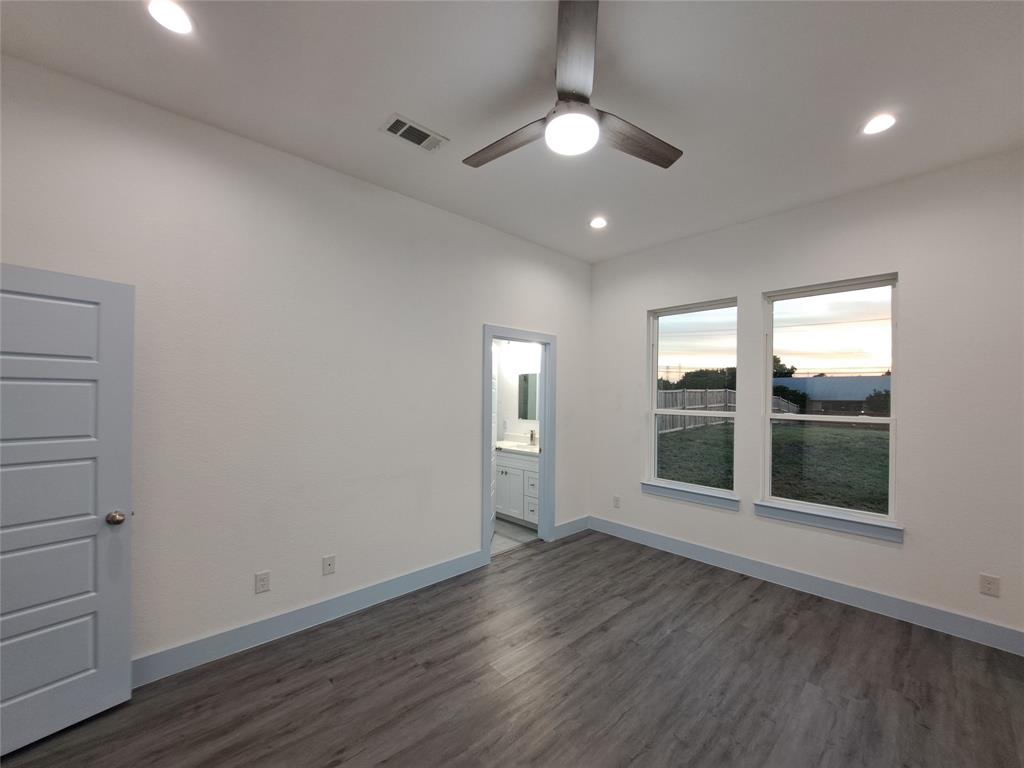 3235 Noor Street Dallas, TX 75233 - Photo 14 of 19 wooden floor in an empty room with a window