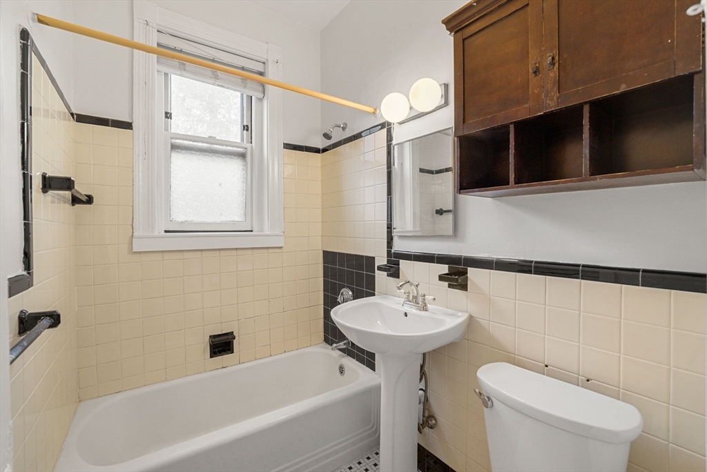 30 Kilsyth Road, Unit 3 Brookline, MA 02445 - Photo 9 of 11 a bathroom with a sink a toilet and shower