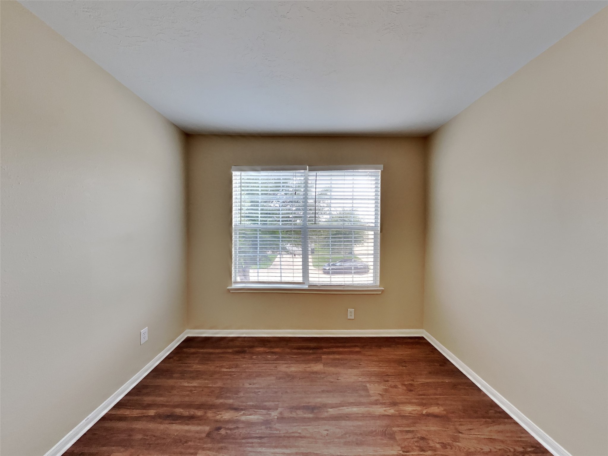 3719 Forney Ridge Lane Houston, TX 77047 - Photo 14 of 21 an empty room with wooden floor and windows