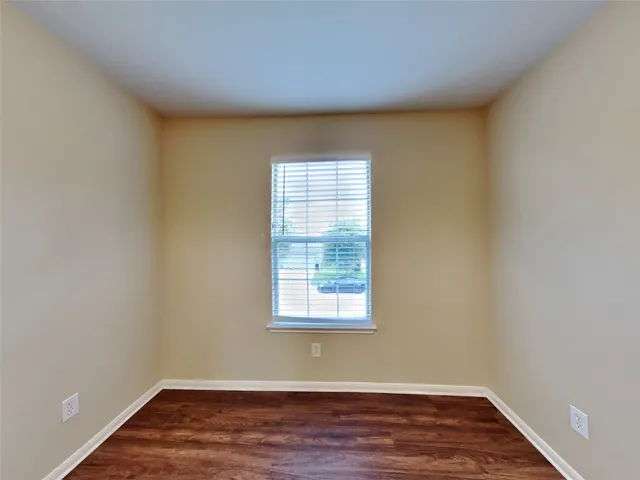 a view of a hallway with the wooden floor