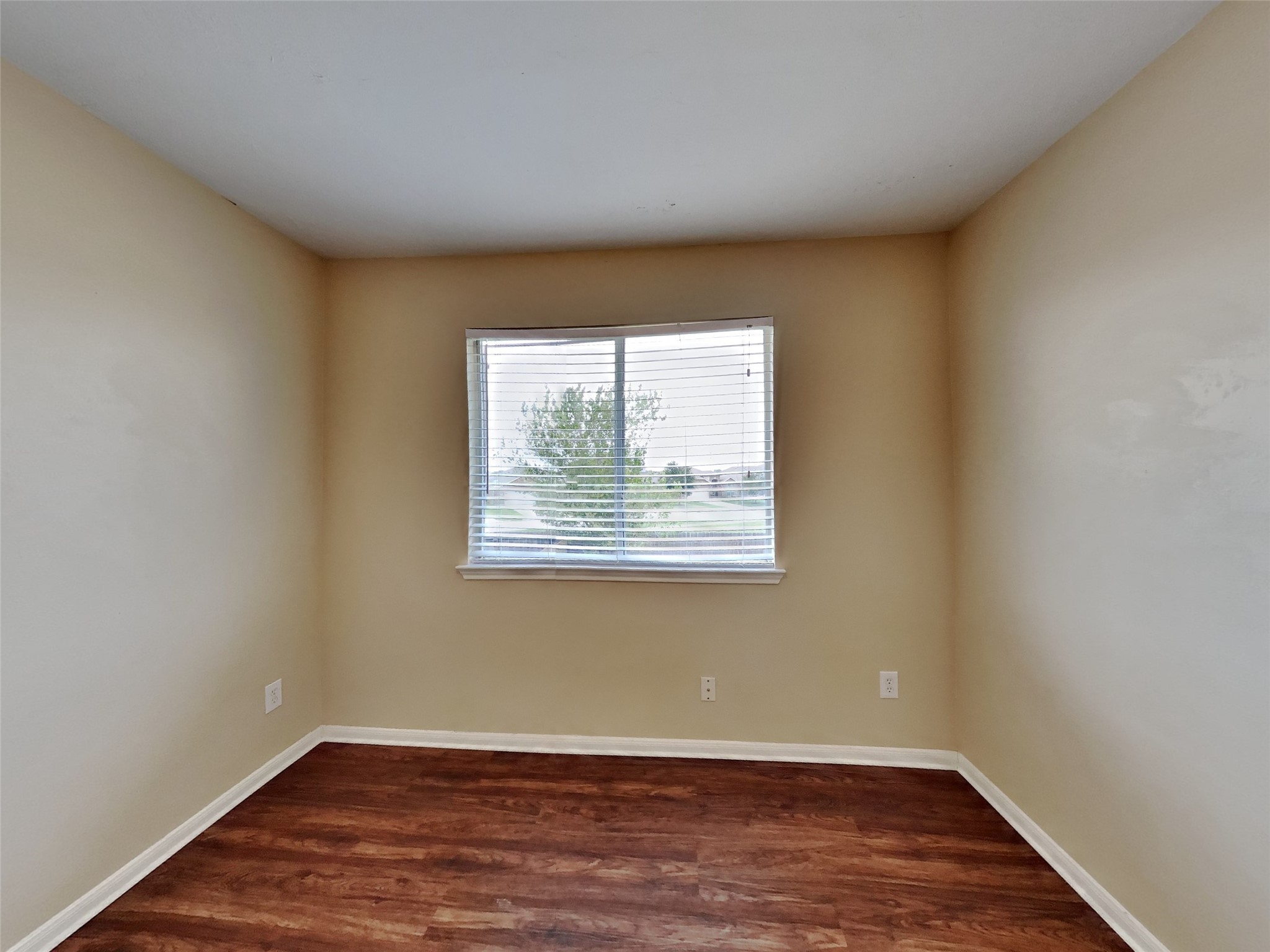 3719 Forney Ridge Lane Houston, TX 77047 - Photo 20 of 21 an empty room with wooden floor and windows