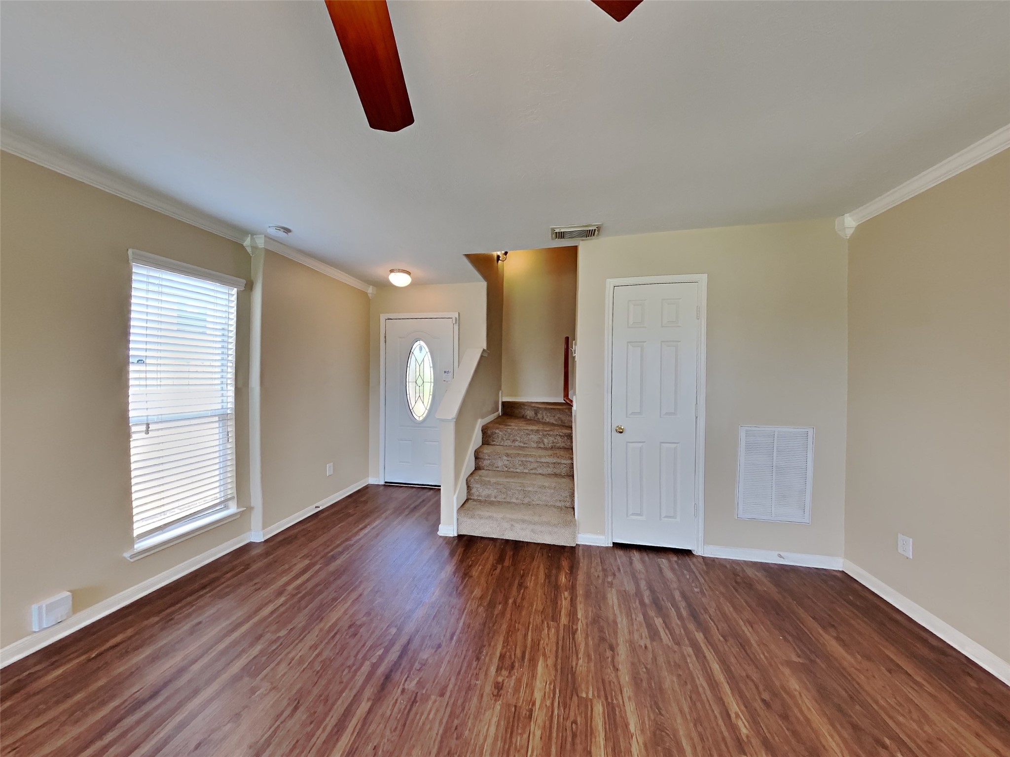 3719 Forney Ridge Lane Houston, TX 77047 - Photo 6 of 21 an empty room with wooden floor and windows