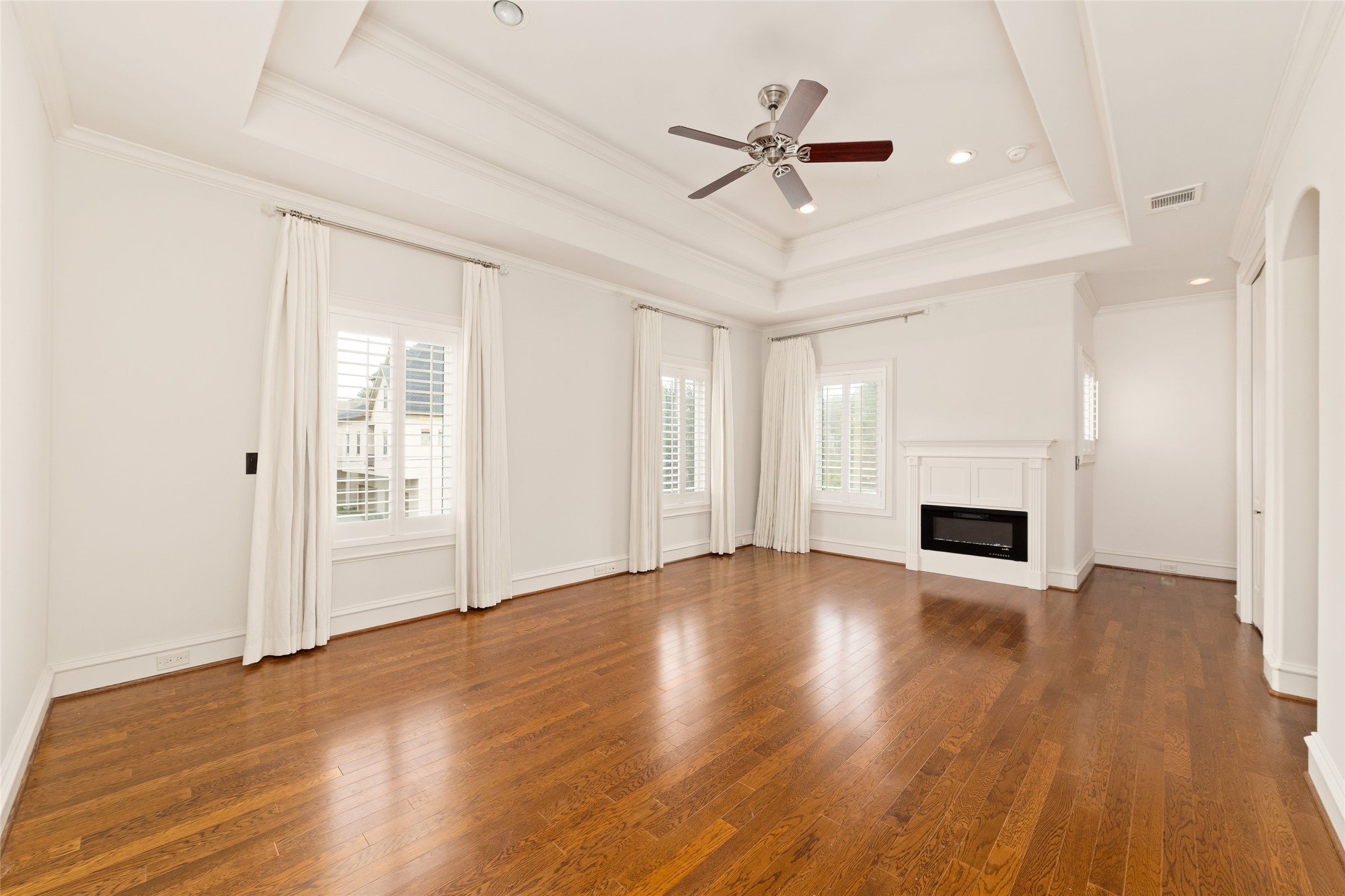 4102 Gramercy Street Houston, TX 77025 - Photo 19 of 35 a view of empty room with wooden floor and fireplace