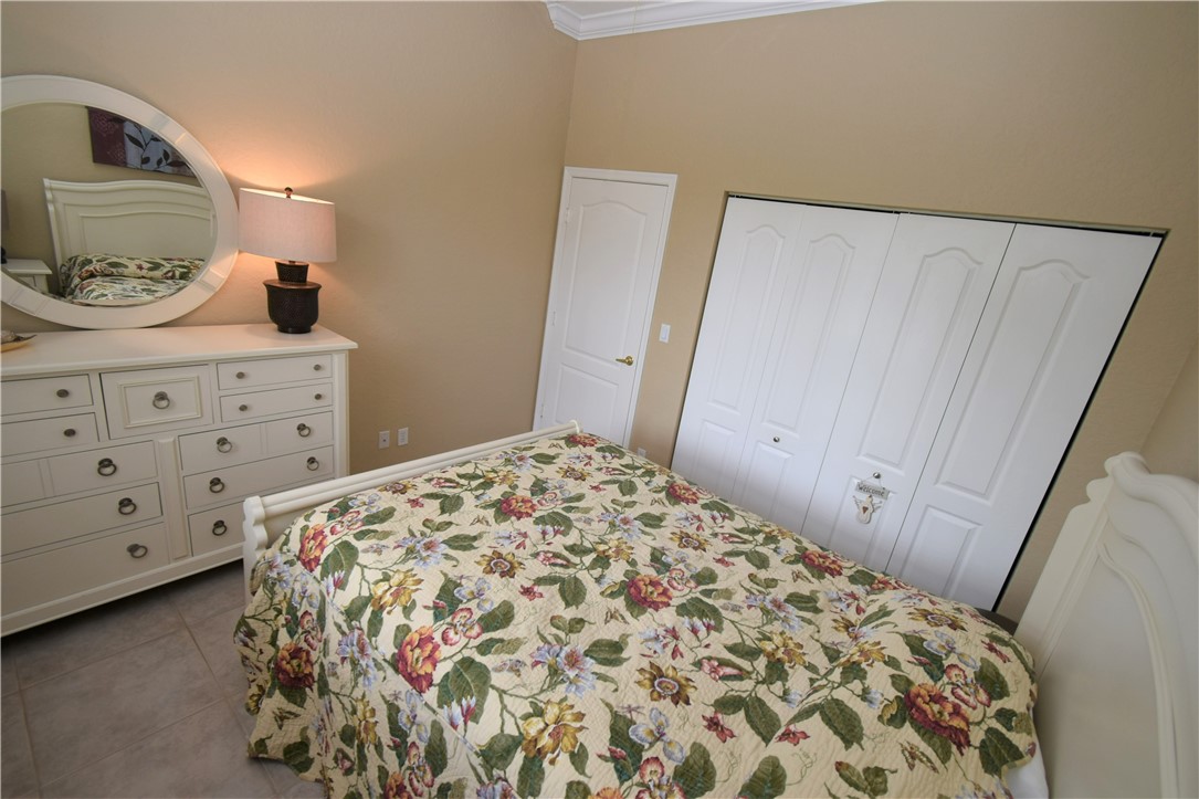 5505 Spanish River Road Fort Pierce, FL 34951 - Photo 22 of 33 a bedroom with a bed and a dresser in it