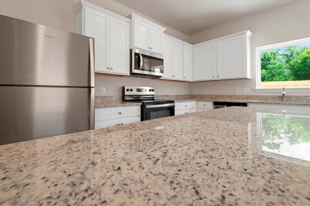 a view of kitchen and dining room with wooden floor